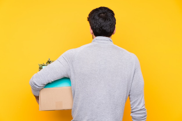 Man carrying a box full of things