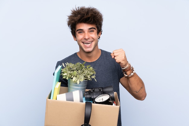 Man carrying a box full of things