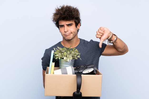 Man carrying a box full of things