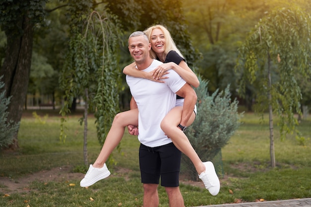 Man carrying a woman on his back