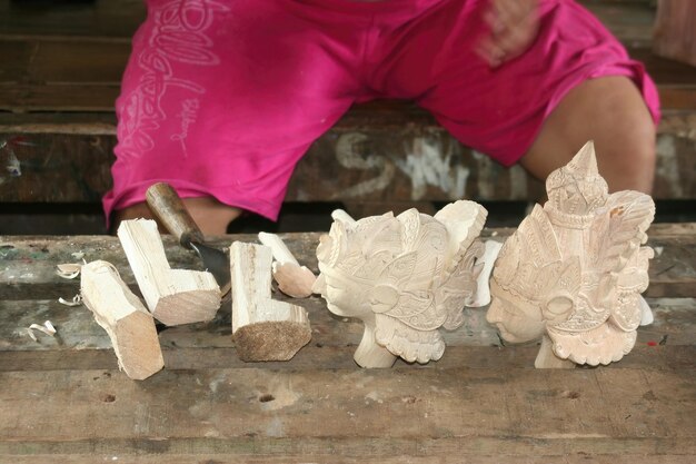 Man carving wood in Indonesia