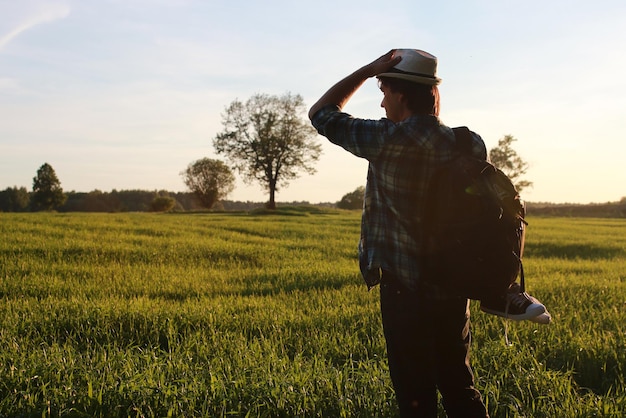 A man in casual clothes is a traveler in the open spaces