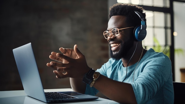 A man in a casual outfit works on a laptop in his office