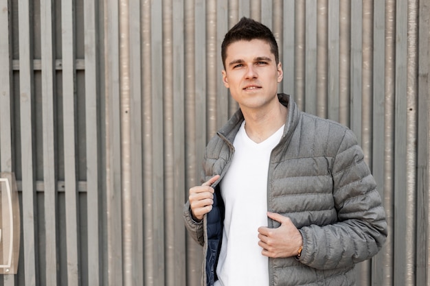 Man in casual outwear with jacket outdoors