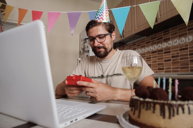 Man celebrating birthday online in quarantine time