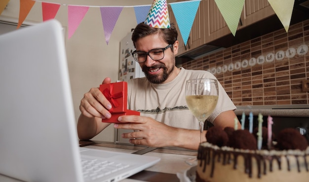 Man celebrating birthday online in quarantine time