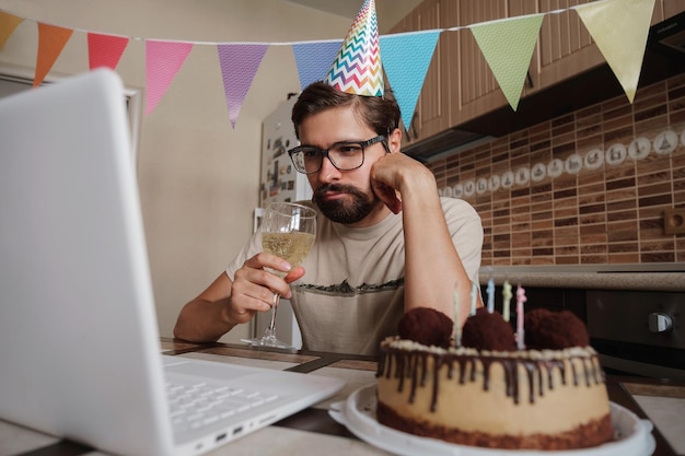 Man celebrating birthday online in quarantine time