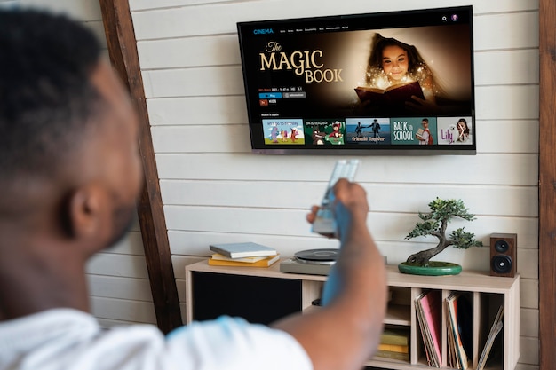 man changing the film on streaming service