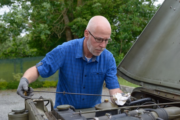 Photo man checked the engine oil level