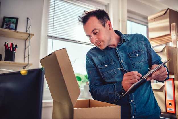 Man checking package for delivery