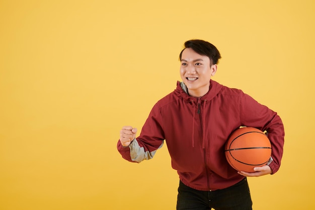 Man cheering for basketball team