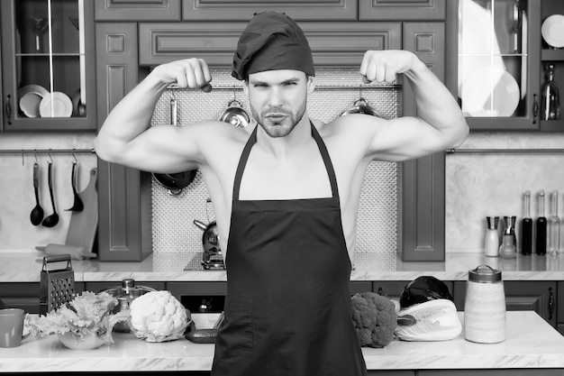 Man chef in apron on sexy torso show biceps triceps