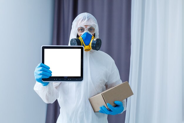 Man in chemical protective suit on background. Virus research