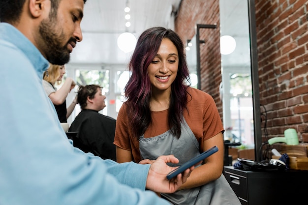 Photo man choosing a hairstyle at a barber