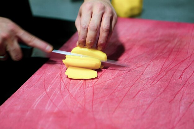 Man chops the potatoes for cooking