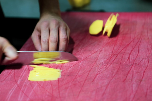 Man chops the potatoes for cooking