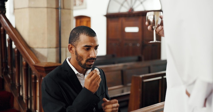 Photo man church and communion ritual with priest for sign of sacrifice religion or gratitude for love people spiritual and worship with bread wine or symbol of jesus christ blood in chapel by pastor