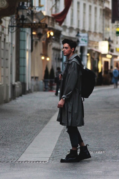 man in city street at night