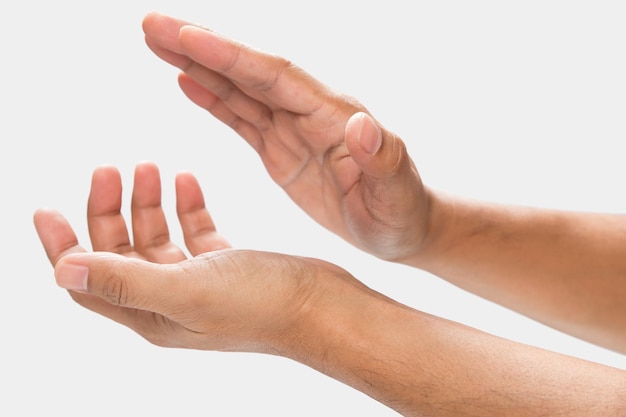 A man clapping hands on a gray background