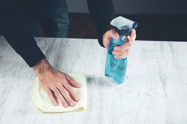 Man cleaning cloth