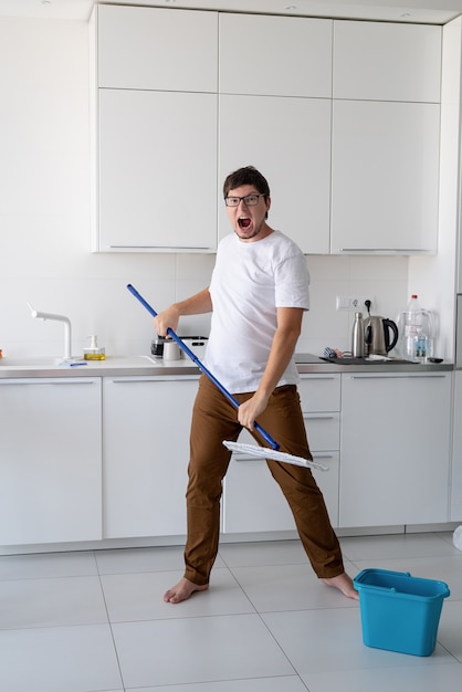 man cleaning home with mop