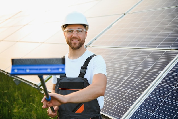 man cleaning solar power washing