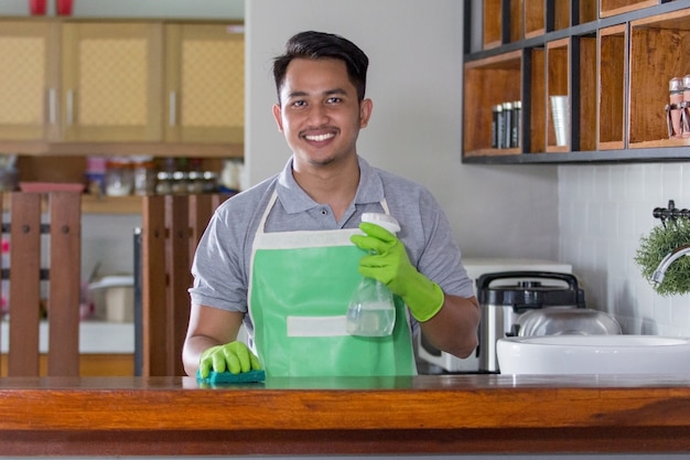 Man cleaning table