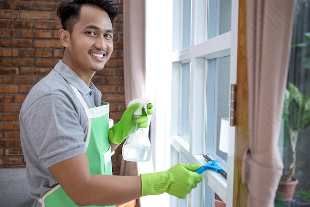 Man cleaning window