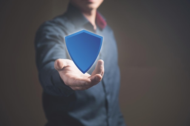 Man clicking on viral screen with shield protection concept