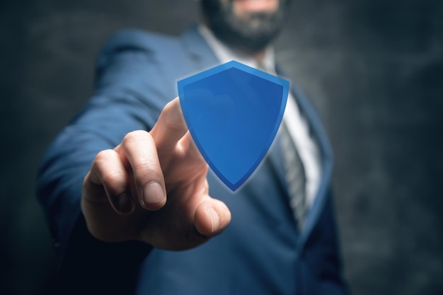 Man clicking on viral screen with shield protection concept