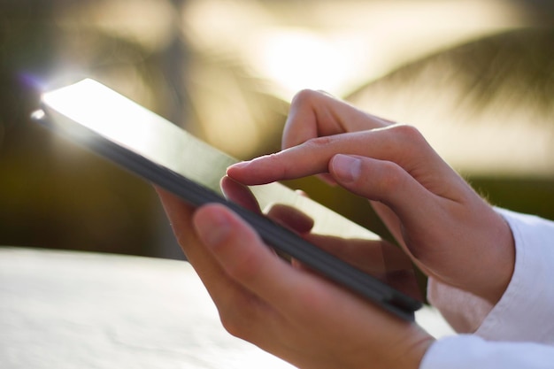 Man clicks on a digital tablet at morning