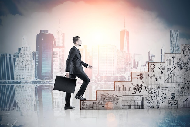 Man climbing stairs and cityscape at dawn