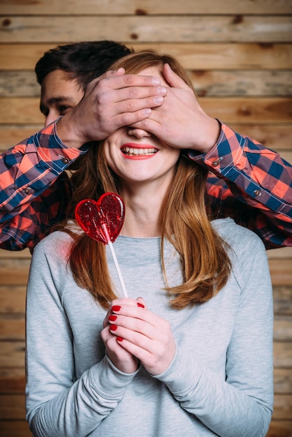 Man closes his eyes girl