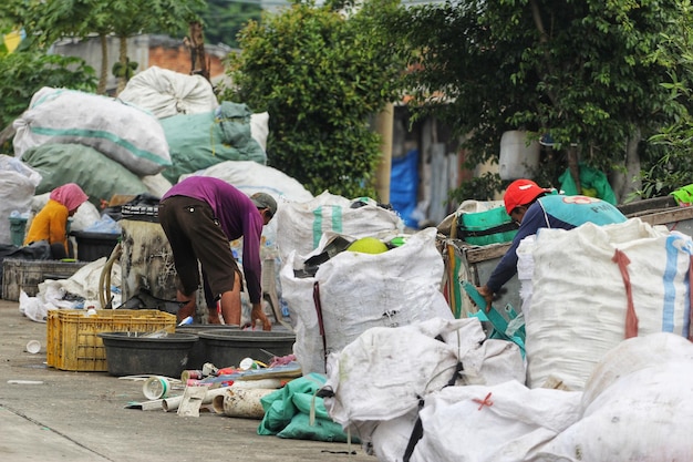 A man collecting used bottles