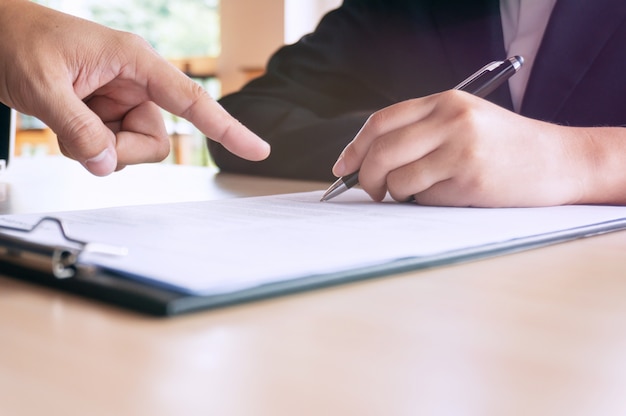 Photo man completing application form during job interview. human resources concept.