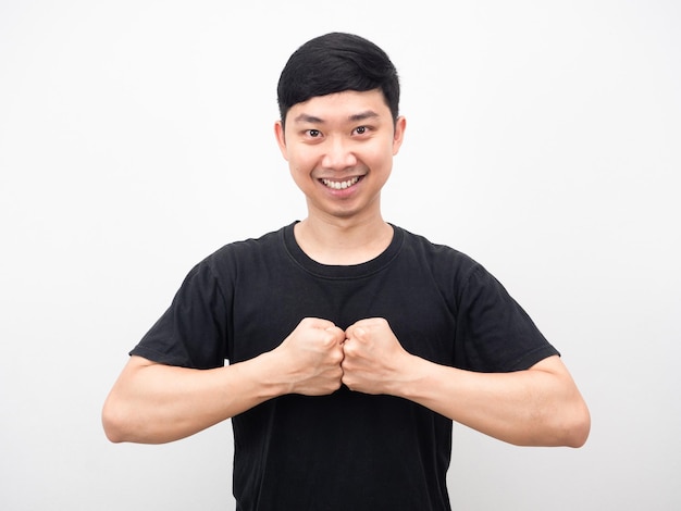 Man confident hit his fist smiling portrait white background