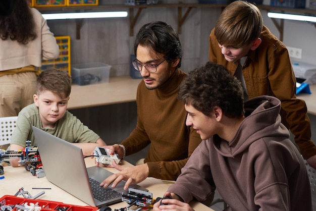 Man connecting the robots online with computer