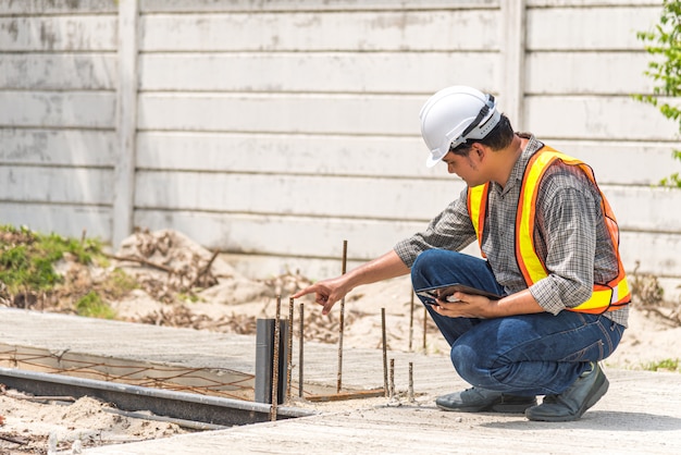 Man construction engineer at construction site