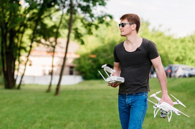 Man controls drone on the street