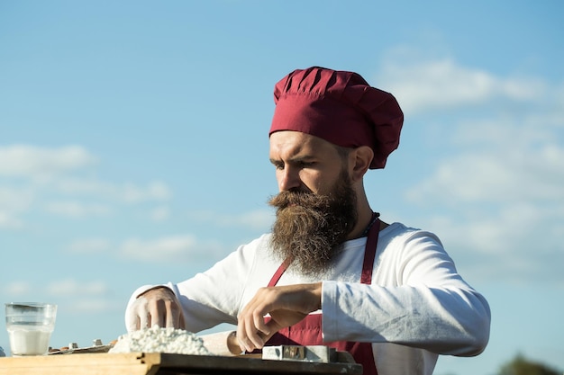 Man cook with rolling pin