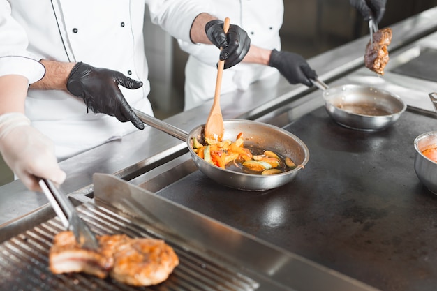 Man cooking a dish in a restaurant