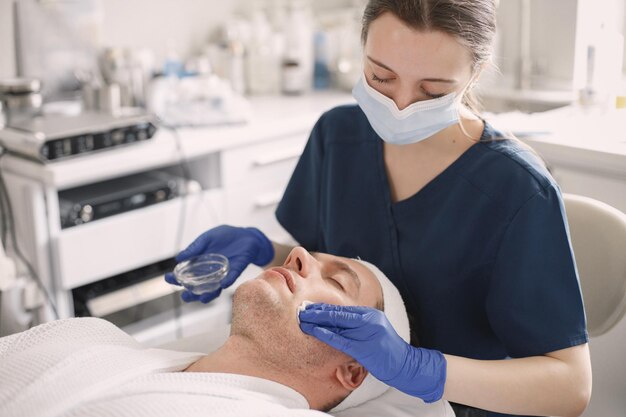 Man in cosmetologist cabinet has a skincare procedure