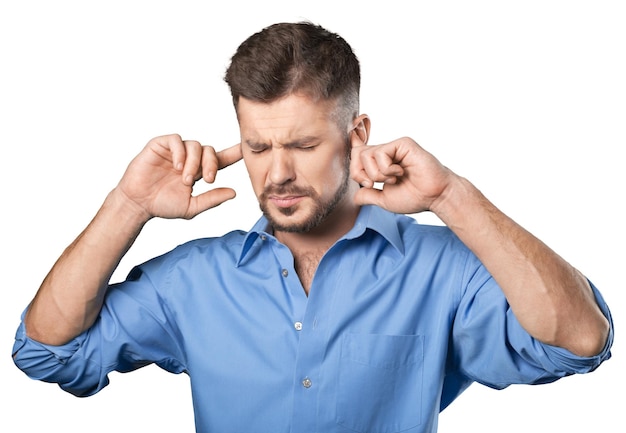 Man covers his ears with his hands on background