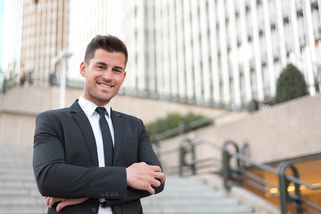 Man crossed arms smiling businessman