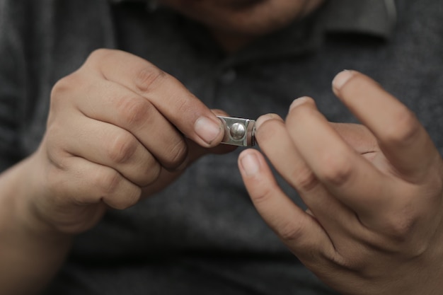 A man cuts his nails