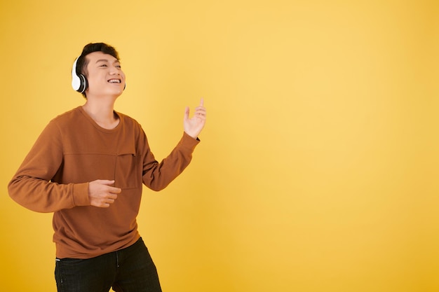 Man Dancing to Music in Headphones