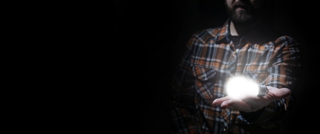 Man in dark with glow bulb