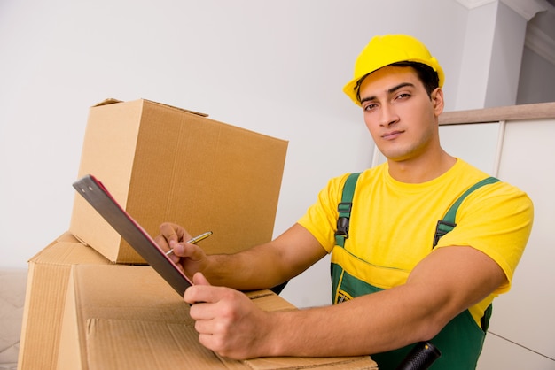 Photo man delivering boxes during house move