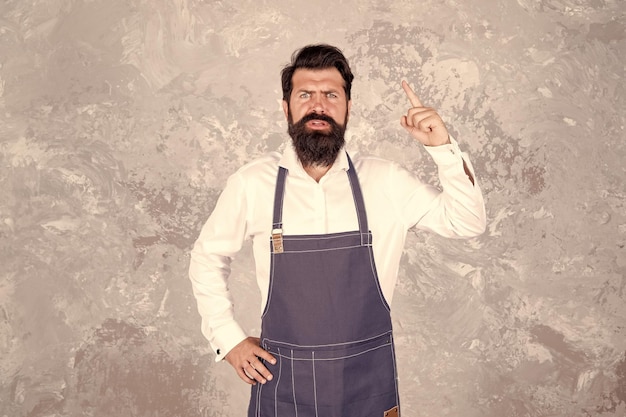 Man denim apron stylish barbershop staff bearded hipster warning danger concept