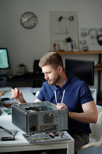 Man disassembling computer processor